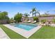 Inviting rectangular pool with surrounding patio and lush landscaping at 1918 W Bonanza Ln, Phoenix, AZ 85085