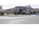 House exterior view with landscaping and flag at 2052 N Montclair Ln, Casa Grande, AZ 85122