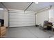 Garage with large door, flooring and rocking chair at 2052 N Montclair Ln, Casa Grande, AZ 85122