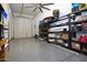 Garage with shelving and large overhead door at 2052 N Montclair Ln, Casa Grande, AZ 85122