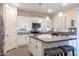 White kitchen with granite countertops, large island, and stainless steel appliances at 2052 N Montclair Ln, Casa Grande, AZ 85122