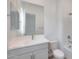 Bathroom features a modern vanity with a framed mirror and a white toilet at 22663 E Happy Rd, Queen Creek, AZ 85142