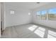 Bedroom featuring carpet flooring and large windows for ample natural lighting at 22663 E Happy Rd, Queen Creek, AZ 85142