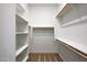 Bright walk-in closet with shelving and rod storage at 22663 E Happy Rd, Queen Creek, AZ 85142