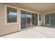 Spacious covered patio with sliding glass doors and bright light at 22663 E Happy Rd, Queen Creek, AZ 85142