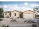 One-story home with tan exterior, tile roof, and two-car garage at 22669 E Happy Rd, Queen Creek, AZ 85142