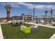 Community pool area with ping pong table and seating at 22669 E Happy Rd, Queen Creek, AZ 85142