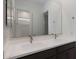 Bathroom featuring double sinks, a large mirror, and modern fixtures at 22670 E Happy Rd, Queen Creek, AZ 85142