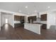 Bright, modern kitchen featuring stainless appliances, a large island, and white subway tile backsplash at 22670 E Happy Rd, Queen Creek, AZ 85142