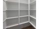 Walk-in pantry with multiple shelves providing ample storage space at 22670 E Happy Rd, Queen Creek, AZ 85142