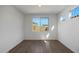 Bedroom with wood-look floors, natural light, and neutral paint at 23128 E Watford Dr, Queen Creek, AZ 85142