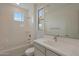 Bright bathroom featuring tub/shower combo and single vanity at 23136 E Watford Dr, Queen Creek, AZ 85142