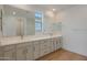 Bright bathroom featuring double vanity, modern fixtures, and wood-look tile flooring at 23136 E Watford Dr, Queen Creek, AZ 85142