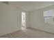 Neutral bedroom featuring carpeted floors, and ensuite bathroom access at 23136 E Watford Dr, Queen Creek, AZ 85142