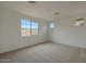 Carpeted bedroom with multiple windows and neutral walls, creating a bright, open space at 23136 E Watford Dr, Queen Creek, AZ 85142