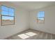 Bright bedroom featuring large windows and carpeted floors at 23136 E Watford Dr, Queen Creek, AZ 85142