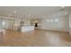 Expansive living area merges seamlessly into the kitchen, bathed in light from strategically placed windows at 23136 E Watford Dr, Queen Creek, AZ 85142