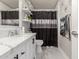 Modern bathroom with white vanity and black accents at 2317 W Danbury Rd, Phoenix, AZ 85023