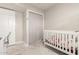 Bedroom with crib and closet, ready for a new baby at 2317 W Danbury Rd, Phoenix, AZ 85023