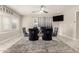 Elegant dining area with a glass table and black velvet chairs at 2317 W Danbury Rd, Phoenix, AZ 85023