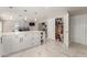 Modern kitchen with white cabinets, quartz countertops and pantry at 2317 W Danbury Rd, Phoenix, AZ 85023