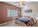 Bedroom with window shutters and ceiling fan at 23619 N 21St St, Phoenix, AZ 85024