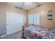 Bright bedroom with double doors and window shutters at 23619 N 21St St, Phoenix, AZ 85024