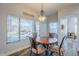 Kitchen dining area with wood table and four chairs at 23619 N 21St St, Phoenix, AZ 85024