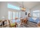 Dining room with a wooden table, chairs, and a chandelier at 23619 N 21St St, Phoenix, AZ 85024