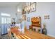 Dining room with a long wooden table and antique buffet at 23619 N 21St St, Phoenix, AZ 85024