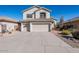 Two-story house with a two-car garage and desert landscaping at 23619 N 21St St, Phoenix, AZ 85024