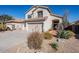 Two-story home with desert landscaping and a two-car garage at 23619 N 21St St, Phoenix, AZ 85024