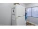 White kitchen with stainless steel appliances and granite countertops at 23619 N 21St St, Phoenix, AZ 85024