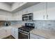 Kitchen with stainless steel appliances and granite countertops at 23619 N 21St St, Phoenix, AZ 85024