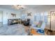 Living room with a comfortable seating arrangement, a large rug, and plenty of natural light at 23619 N 21St St, Phoenix, AZ 85024