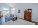 Living room with hardwood floors, a striped couch, and high ceilings at 23619 N 21St St, Phoenix, AZ 85024