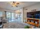 Living room with hardwood floors, a cozy seating area, and views of the backyard at 23619 N 21St St, Phoenix, AZ 85024