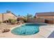 Refreshing kidney-shaped pool with waterfall feature at 23619 N 21St St, Phoenix, AZ 85024