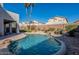 Inviting kidney-shaped pool with waterfall feature at 23619 N 21St St, Phoenix, AZ 85024