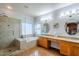 Primary bathroom with double vanity, large shower, and soaking tub at 23619 N 21St St, Phoenix, AZ 85024