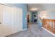 Upstairs hallway with carpet, light blue walls, and built-in closet at 23619 N 21St St, Phoenix, AZ 85024