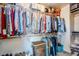 Large walk-in closet with ample shelving and hanging space at 23619 N 21St St, Phoenix, AZ 85024