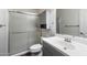 Clean bathroom with a shower/tub combo, vanity with sink, and gray cabinetry at 2472 W Crocus Dr, Phoenix, AZ 85023