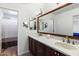 Bathroom with double vanity, large mirror, and shower at 2472 W Crocus Dr, Phoenix, AZ 85023