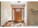 Light and airy entryway with wood floors and a decorative door at 2472 W Crocus Dr, Phoenix, AZ 85023