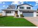 Two-story house with gray garage door and well-manicured lawn at 2472 W Crocus Dr, Phoenix, AZ 85023