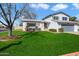 Two-story house with a lush lawn and mature tree in front at 2472 W Crocus Dr, Phoenix, AZ 85023