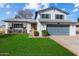 Two-story house with gray garage door and landscaped lawn at 2472 W Crocus Dr, Phoenix, AZ 85023