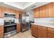 Modern kitchen featuring stainless steel appliances and light wood cabinets at 2472 W Crocus Dr, Phoenix, AZ 85023