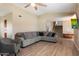 Spacious living room with L-shaped sofa and wood-look floors at 2472 W Crocus Dr, Phoenix, AZ 85023